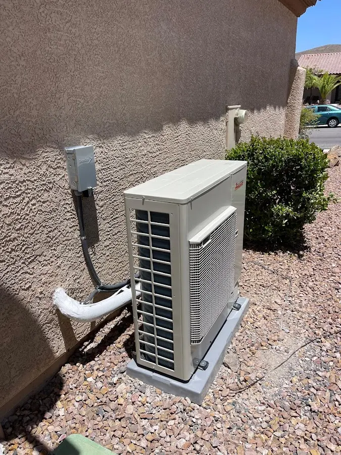 Residential air conditioning condenser unit in Mustang